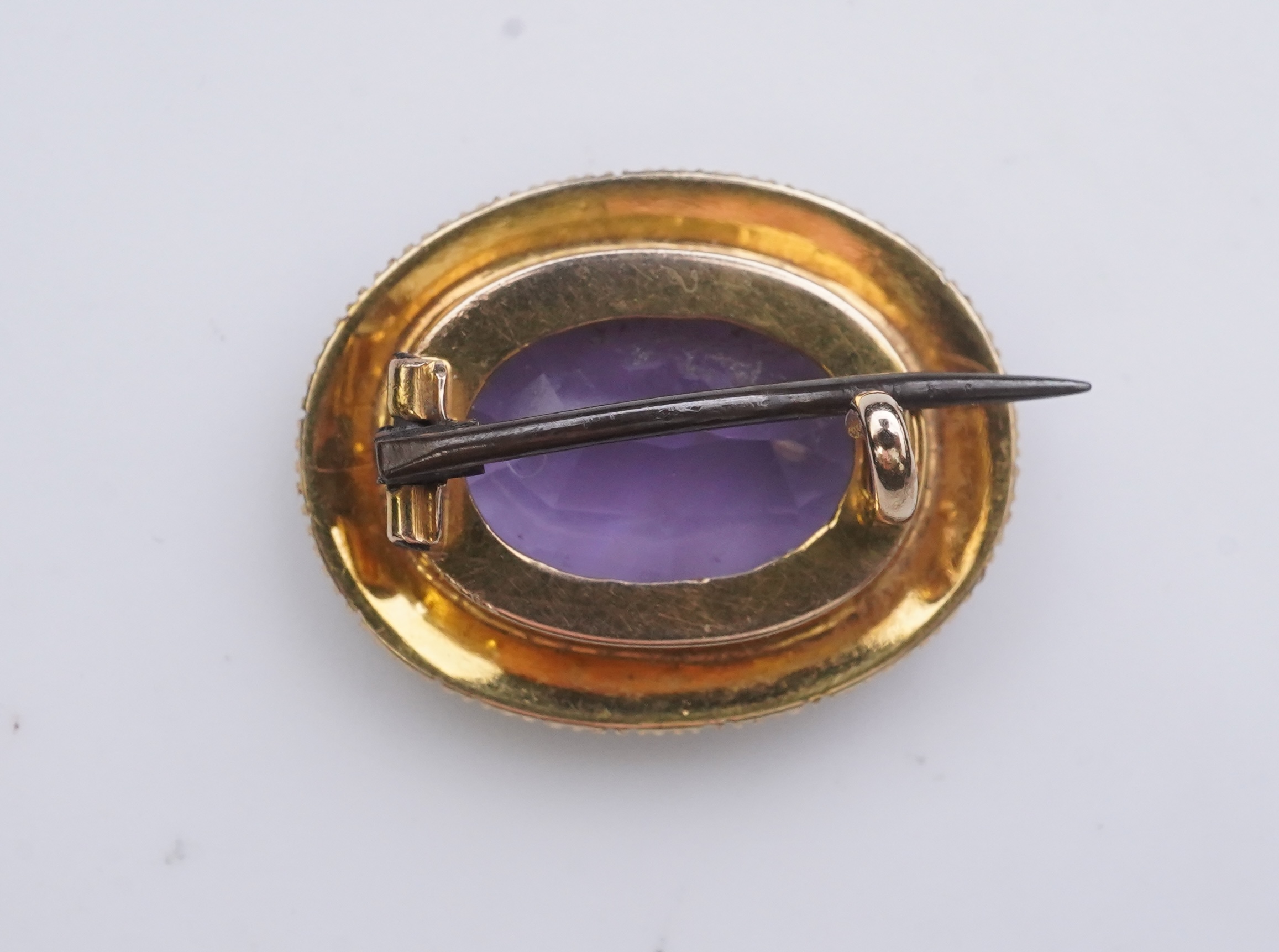 An amethyst brooch and an amethyst mourning ring, early 20th century